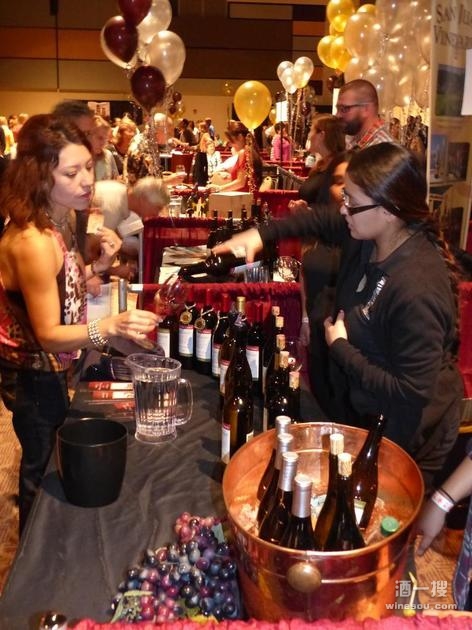 Vereyida Ponce, a student in the Yakima Valley Community College wine making program serves samples of the student-made wines to attendees at Saturday's Tri-City Wine Festival.